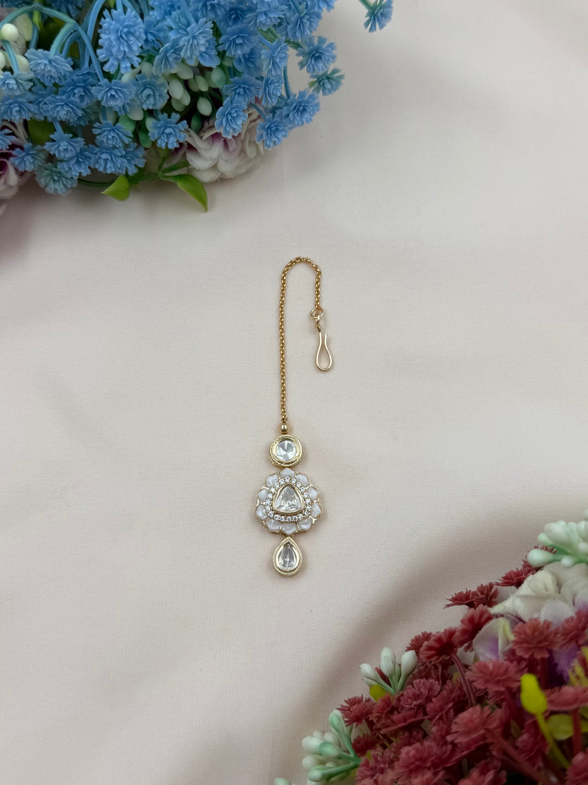 Dropping Moissanite Mang Tika