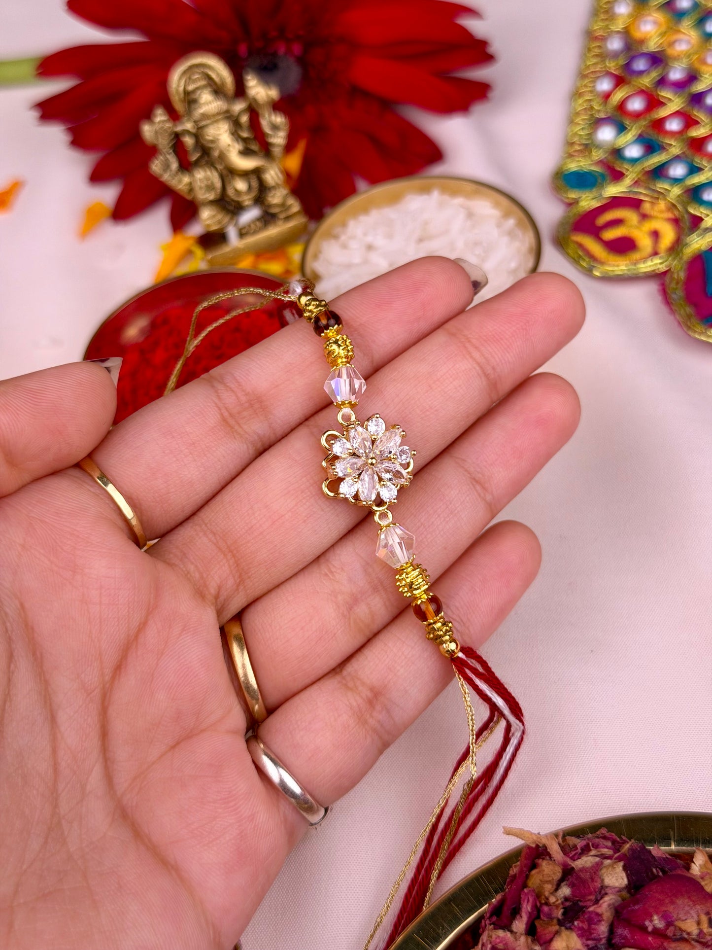 Premium Zircon Flower Spinner Rakhi